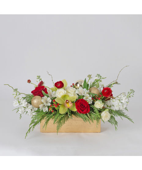 Celebrate the season with our Holly Jolly Christmas Centerpiece, a festive arrangement that brings elegance and joy to any table.