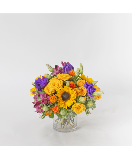 October Sun is a bright and cheerful fall arrangement that captures the warmth of the season.