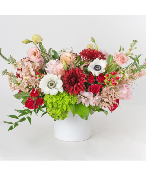 Berry Crush is a lush and romantic Valentine’s Day flower arrangement filled with soft pastels and rich berry tones for a beautifully balanced design.