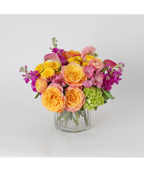 Bright, playful, and bursting with citrus-inspired color, Candied Clementine is a vibrant floral arrangement designed to energize any space. 