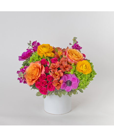 Radiating warmth and vibrant beauty, Citrine Glow is a cheerful Mother’s Day floral arrangement designed to brighten her day with bold color and elegance