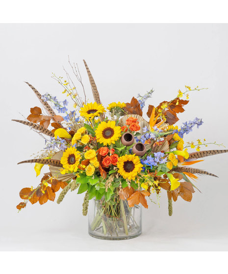 Introducing our Enchanting Fall arrangement, a breathtaking autumn display in a large 10x10