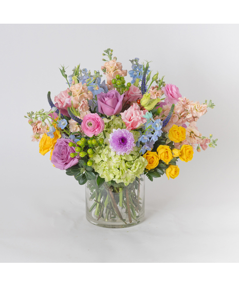 Bring timeless elegance into any space with our French Meadow arrangement, artfully designed in a classic 6-inch glass vase.
