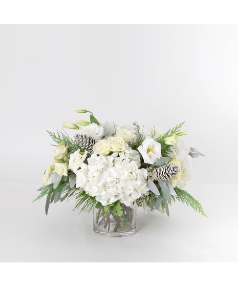 Embrace the serene beauty of winter with our Frosted Fir arrangement.