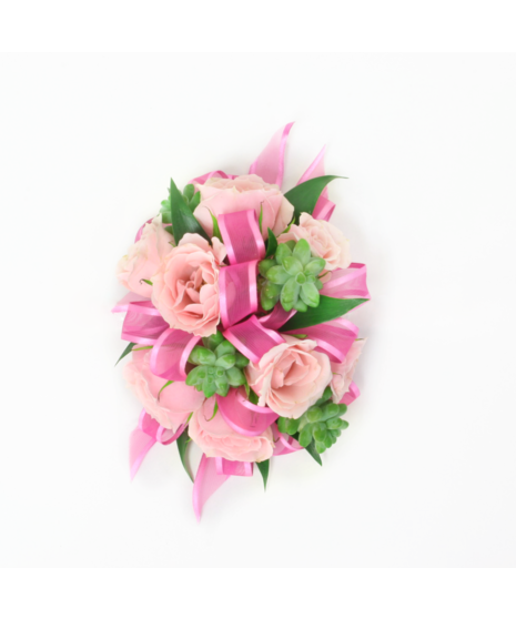 You can never go wrong with a simple spray rose corsage with rose blooms, Italian Ruscus green accents, and pink ribbon. 