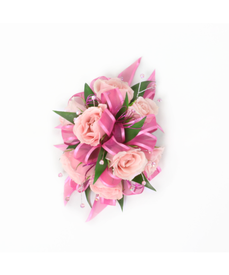 You can never go wrong with a simple spray rose corsage with rose blooms, Italian Ruscus green accents, and pink ribbon. 