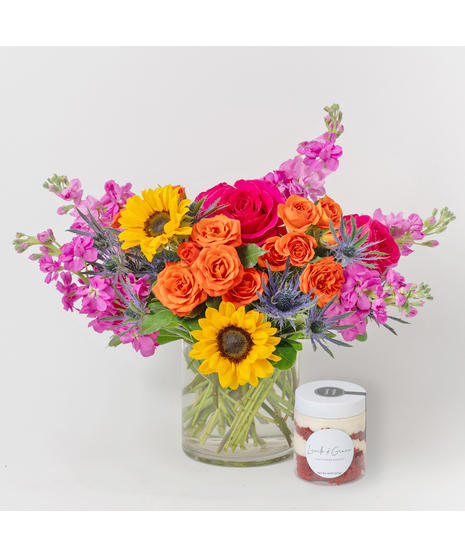 Celebrate the vibrant spirit of the season with our Sweet Blooms Kit, featuring a cheerful floral arrangement paired with a delightful box of classic macarons.