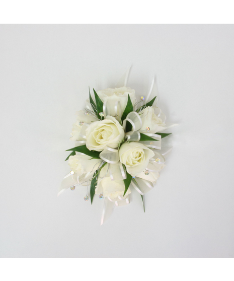 You can never go wrong with a simple spray rose corsage with rose blooms, Italian Ruscus green accents, and white ribbon.